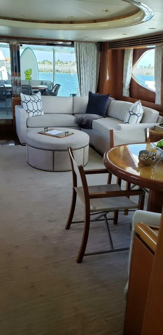 a living room with a couch and a table aboard TORTUGA Yacht for Sale