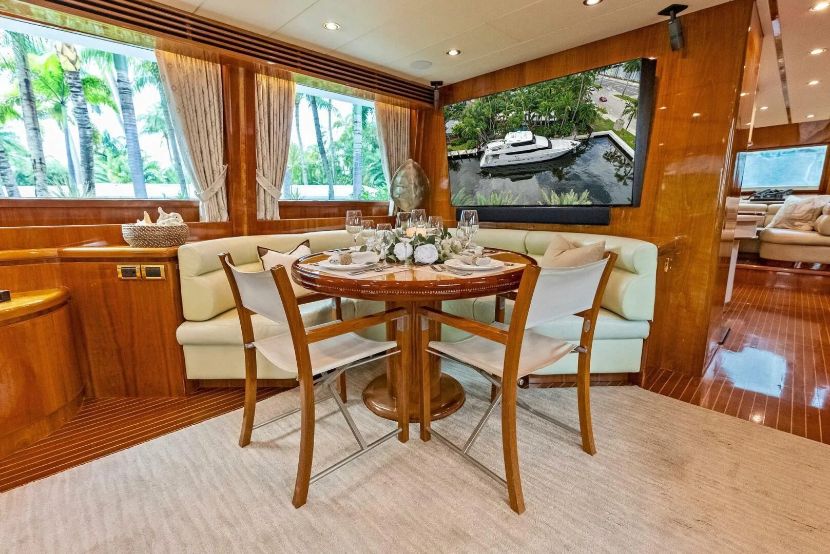 a dining room with a table and chairs aboard TORTUGA Yacht for Sale