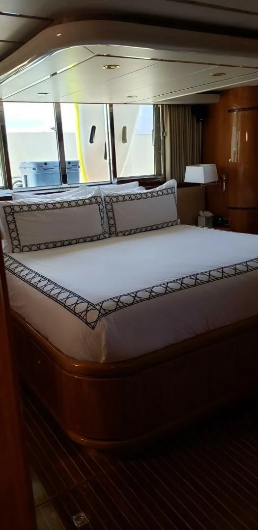 a room with a bed and a desk aboard TORTUGA Yacht for Sale