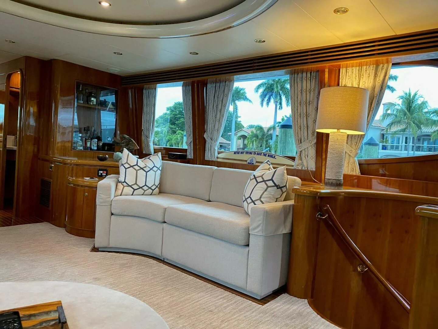 a living room with a couch and a lamp aboard TORTUGA Yacht for Sale