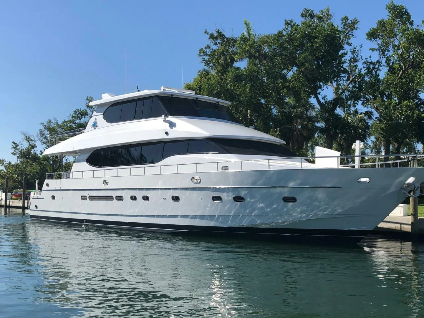 a white yacht on the water aboard TORTUGA Yacht for Sale