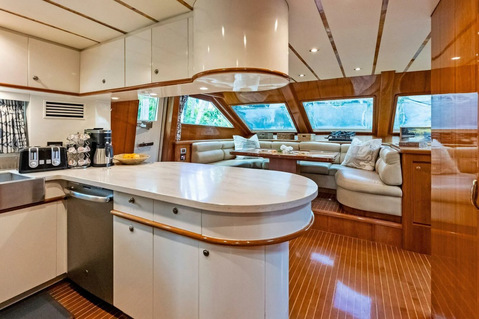 a kitchen with a large island aboard TORTUGA Yacht for Sale
