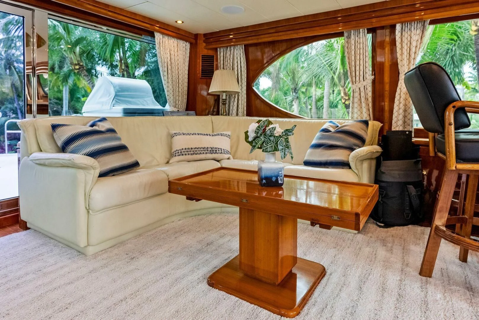 a living room with a couch and coffee table aboard TORTUGA Yacht for Sale