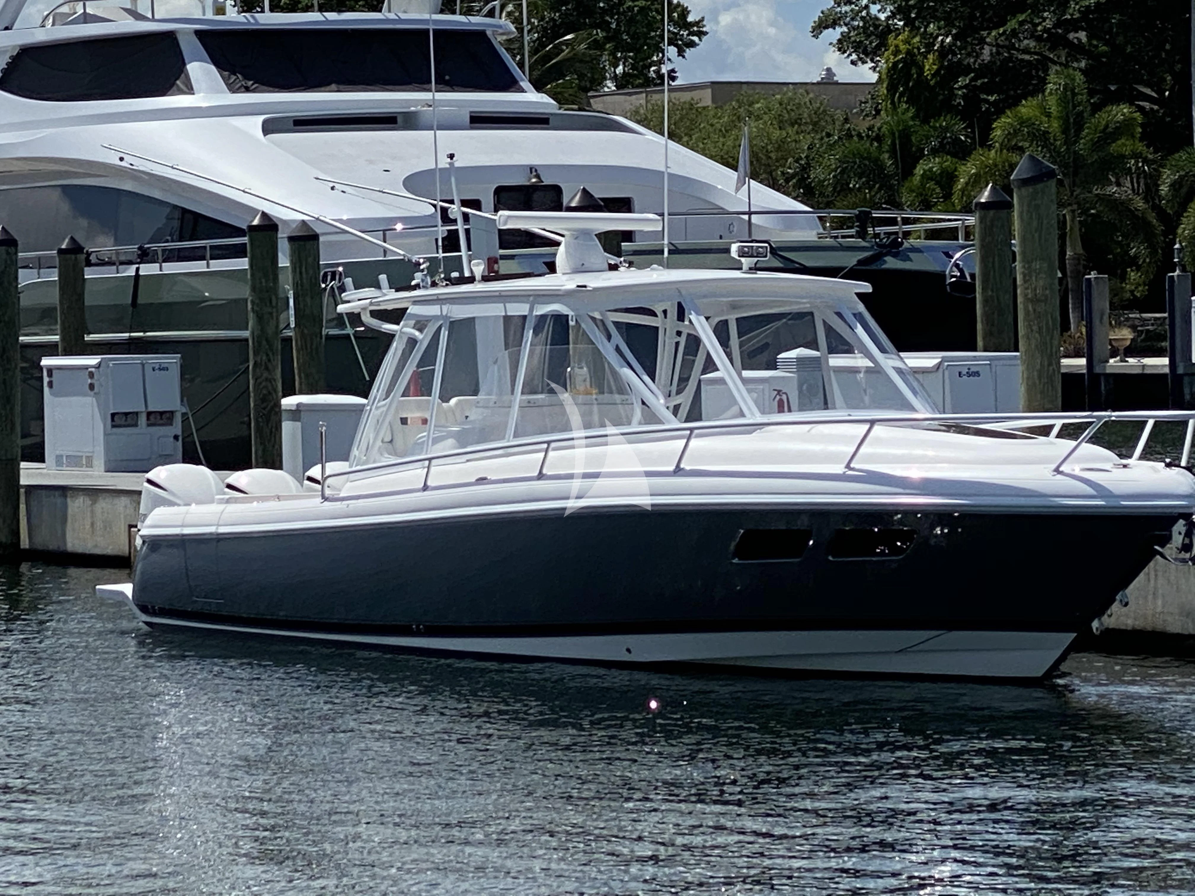 a couple of white yachts aboard TORTUGA Yacht for Sale