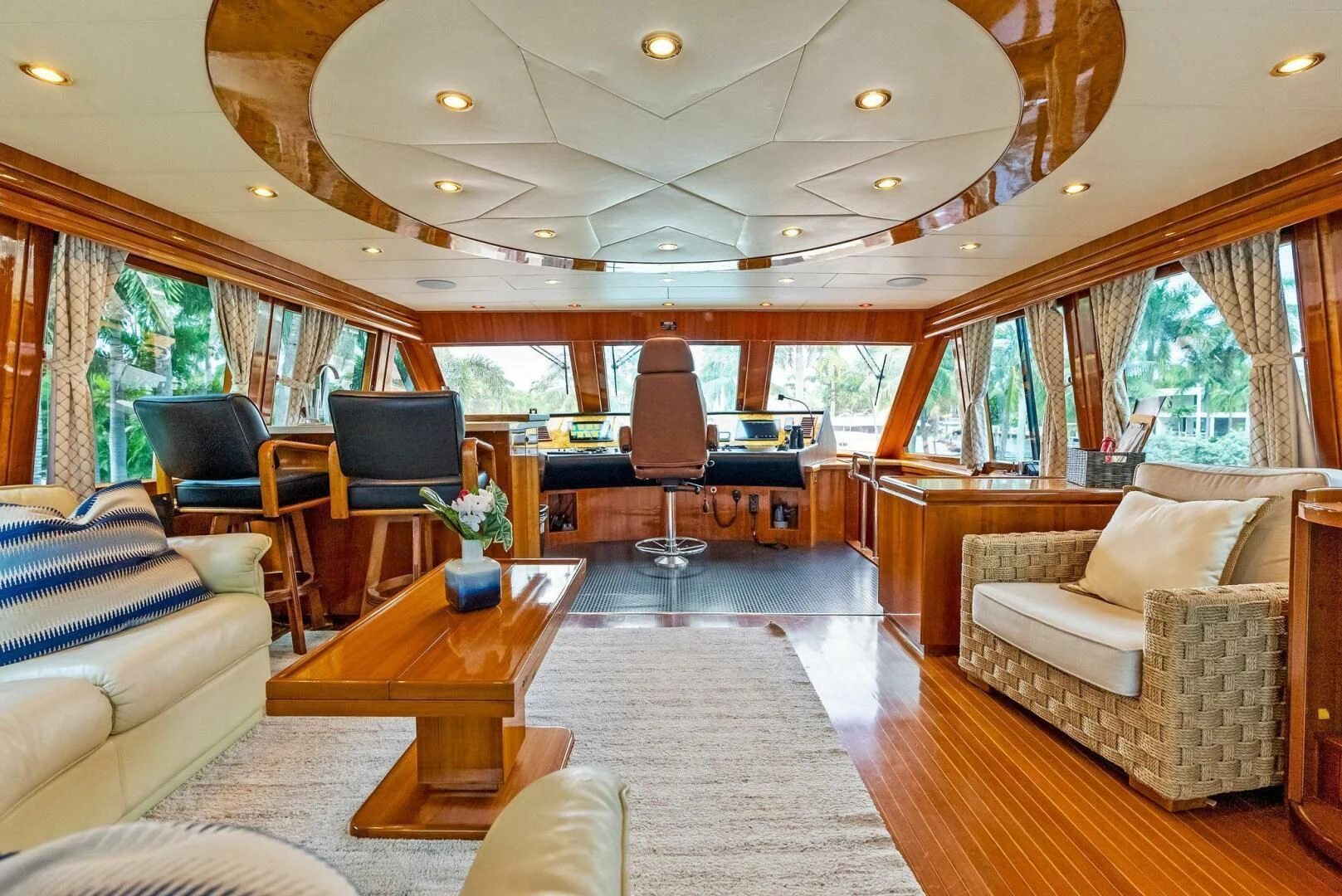 a living room with a large window aboard TORTUGA Yacht for Sale