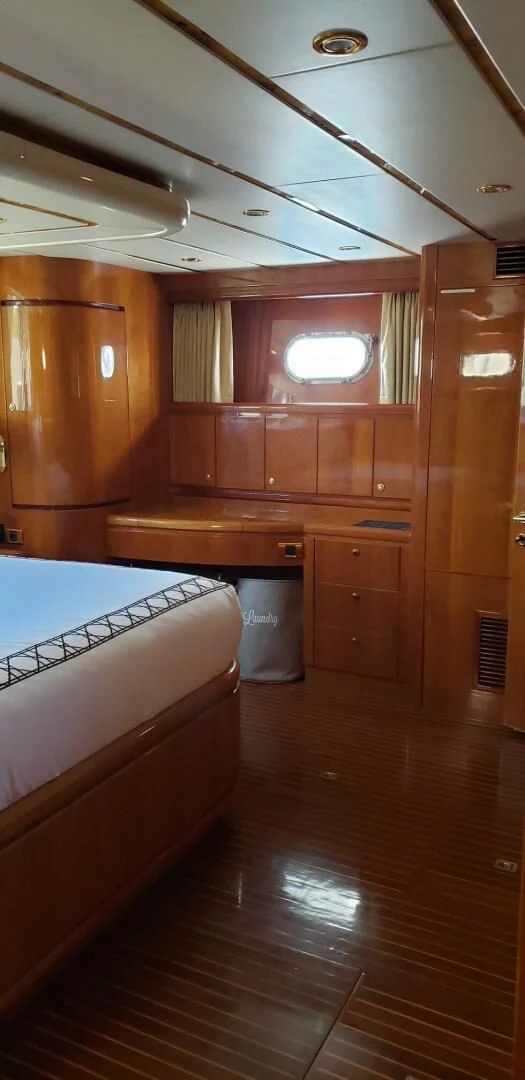 a room with wooden cabinets aboard TORTUGA Yacht for Sale