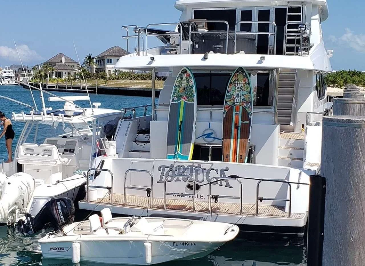 a boat docked at a pier aboard TORTUGA Yacht for Sale