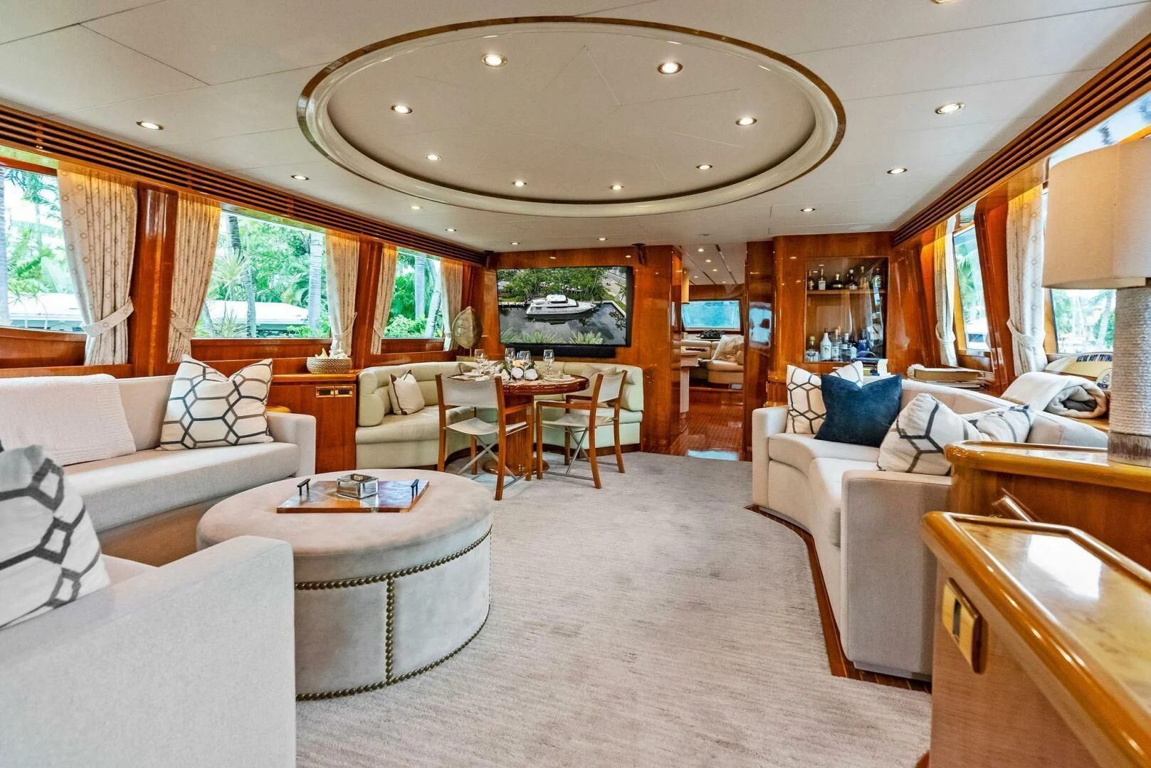 a living room with a large mirror aboard TORTUGA Yacht for Sale