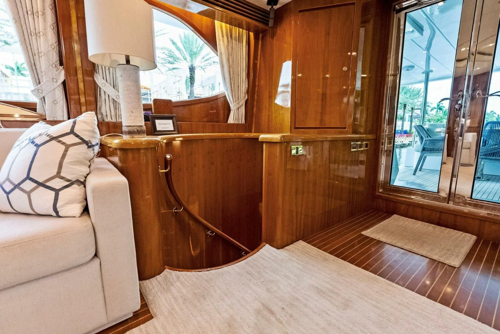 a living room with a wood table aboard TORTUGA Yacht for Sale