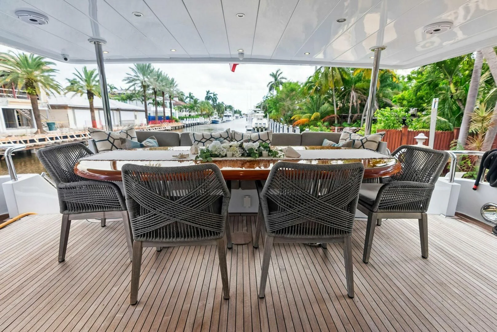 a patio with chairs and tables aboard TORTUGA Yacht for Sale