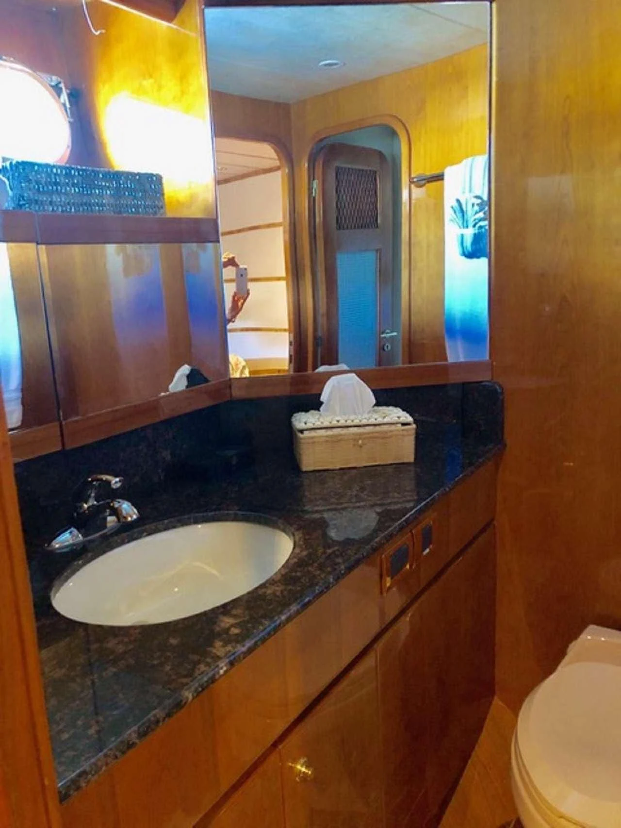 a bathroom with a sink and mirror aboard TORTUGA Yacht for Sale