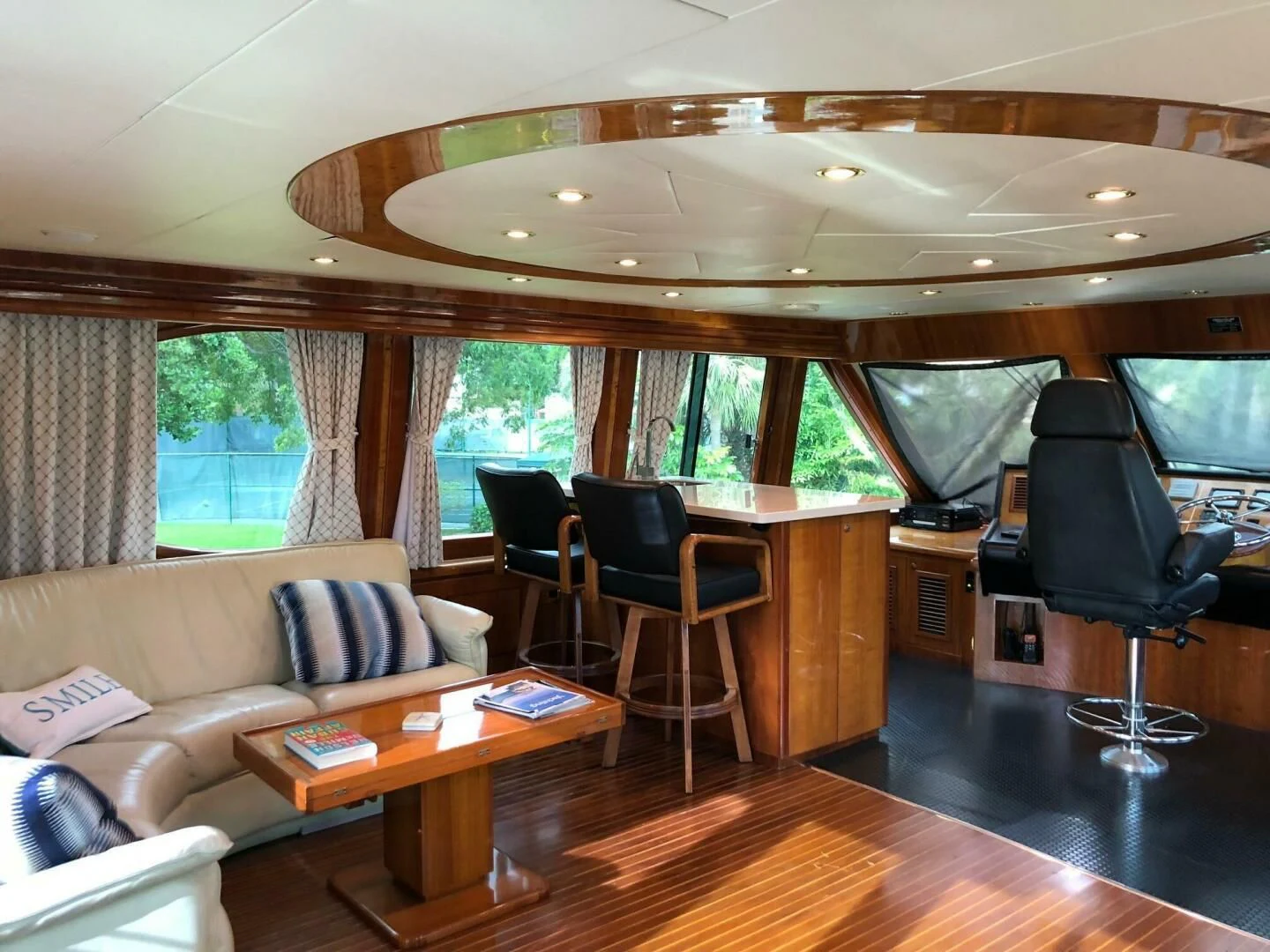 a living room with a couch and a table aboard TORTUGA Yacht for Sale