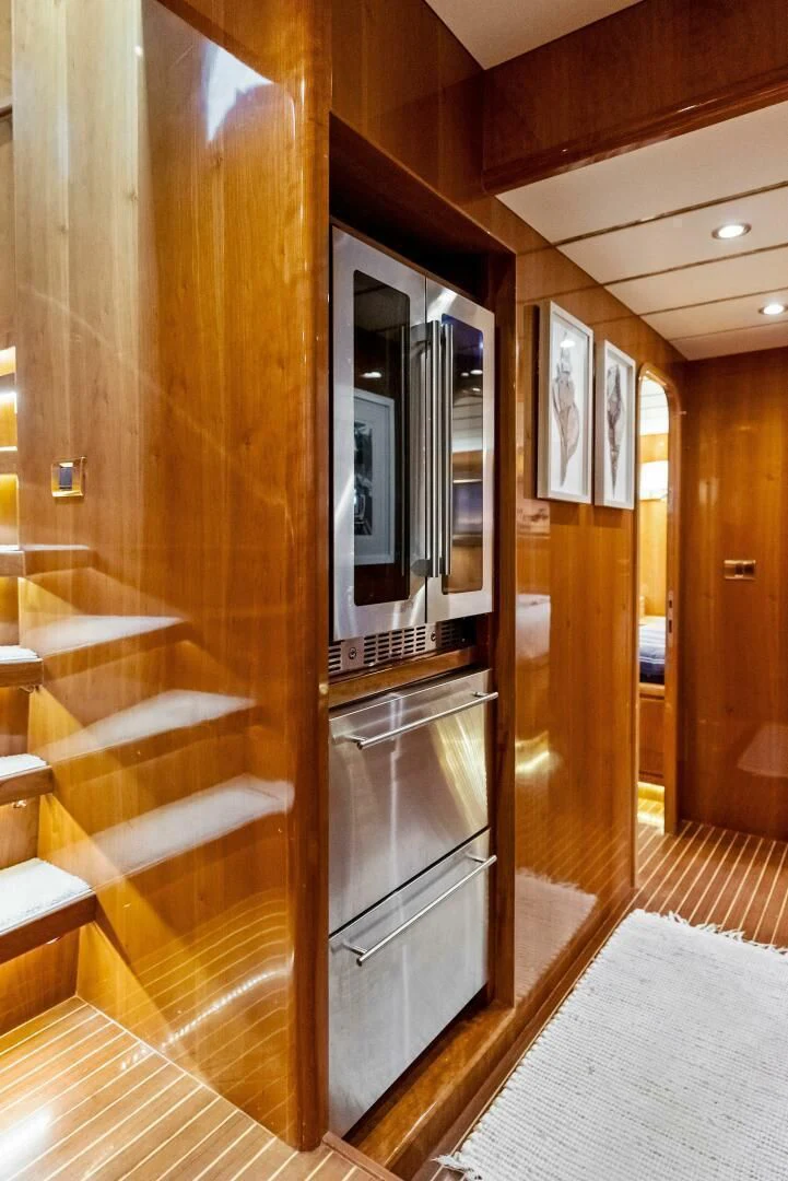 a kitchen with a glass door aboard TORTUGA Yacht for Sale