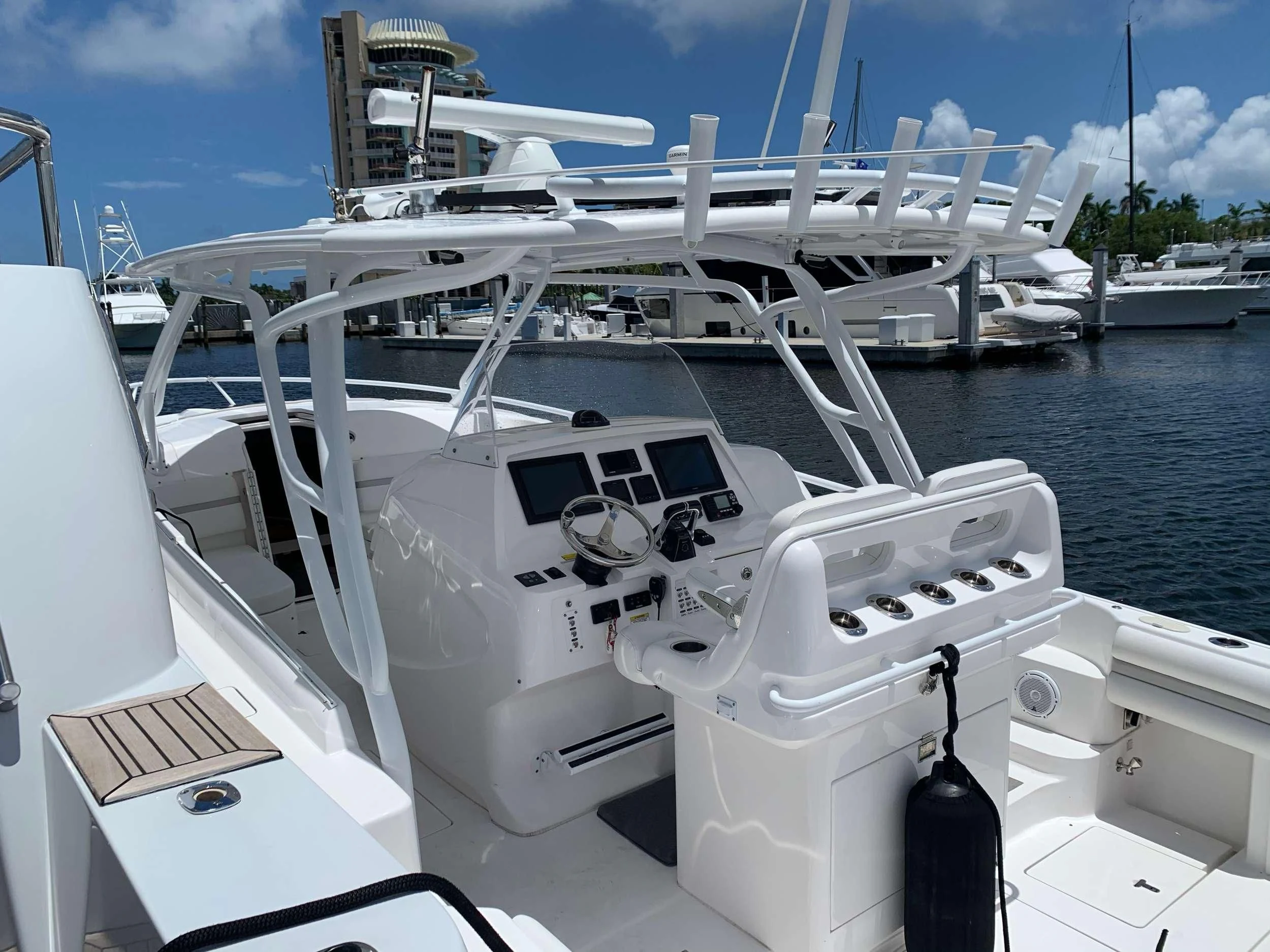 a white boat with a black pole on the deck aboard TORTUGA Yacht for Sale