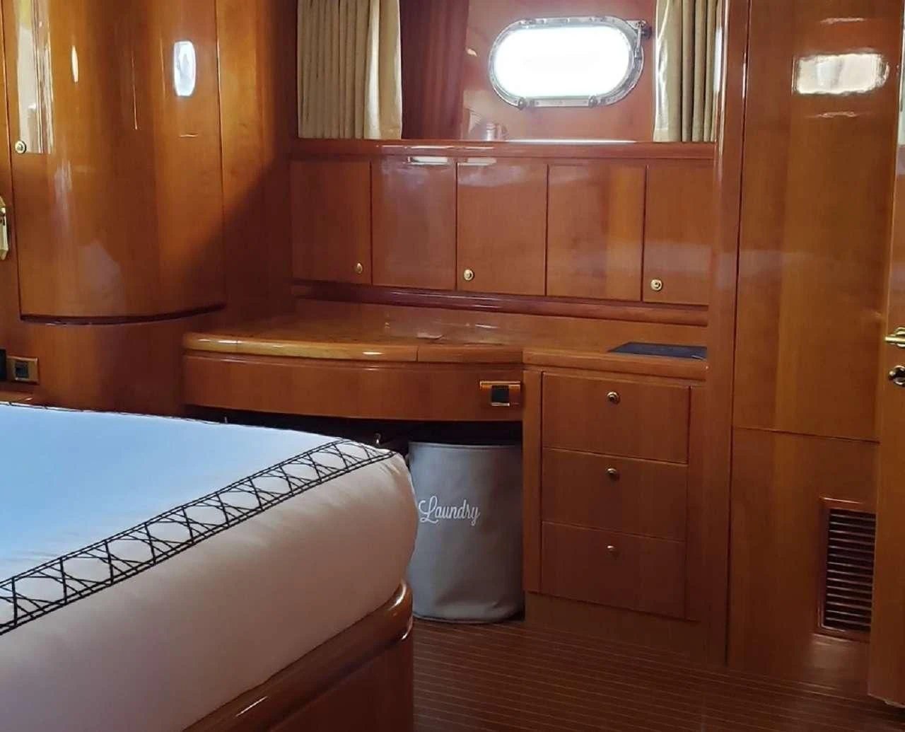 a room with a bed and a trash can aboard TORTUGA Yacht for Sale
