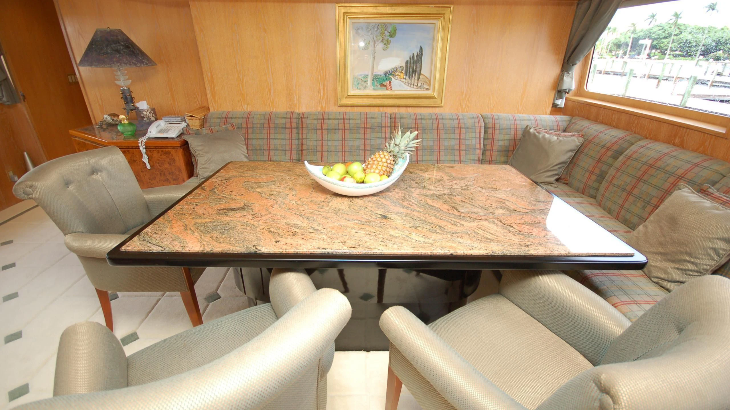 a couch and a table in a room aboard CONTRARIAN ROSE Yacht for Sale