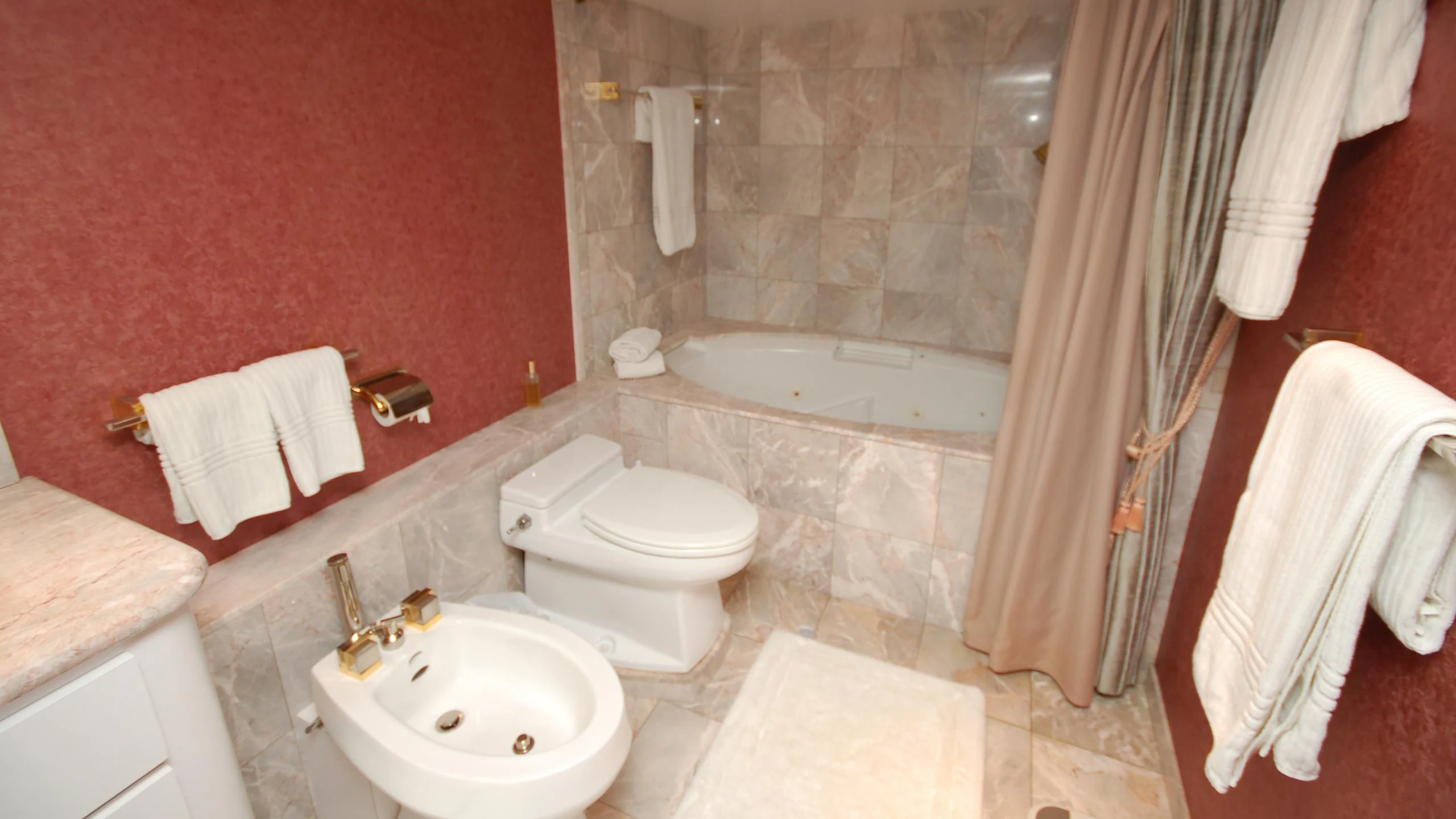 a bathroom with a tub sink toilet and sink aboard CONTRARIAN ROSE Yacht for Sale