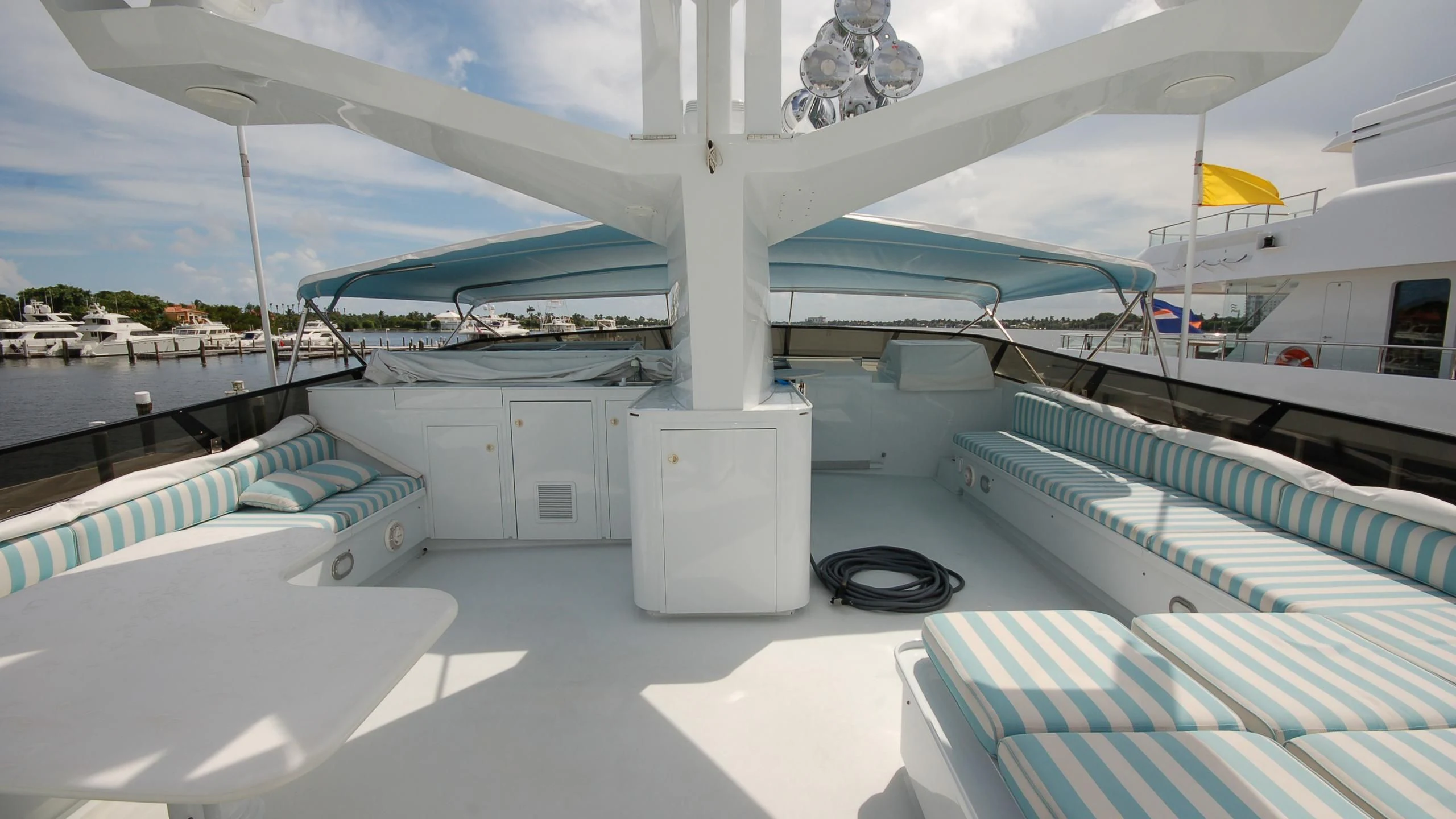 a large white boat with a blue roof aboard CONTRARIAN ROSE Yacht for Sale
