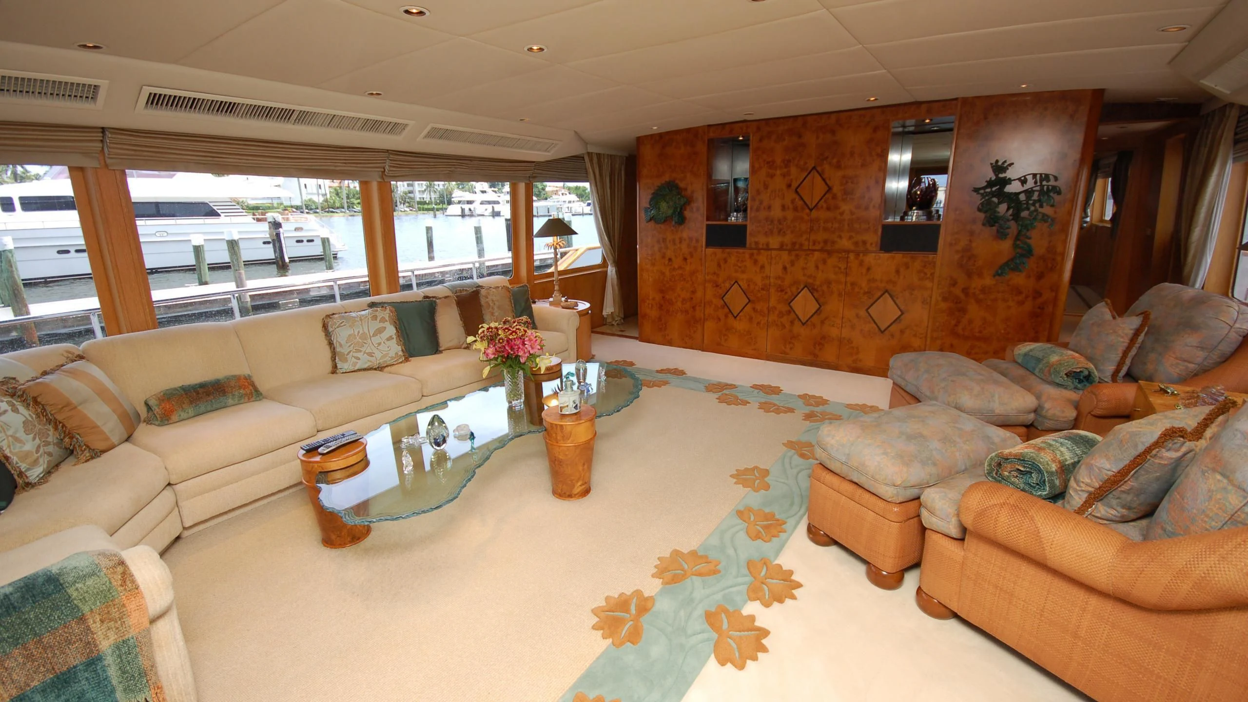 a living room with a couch and a coffee table aboard CONTRARIAN ROSE Yacht for Sale