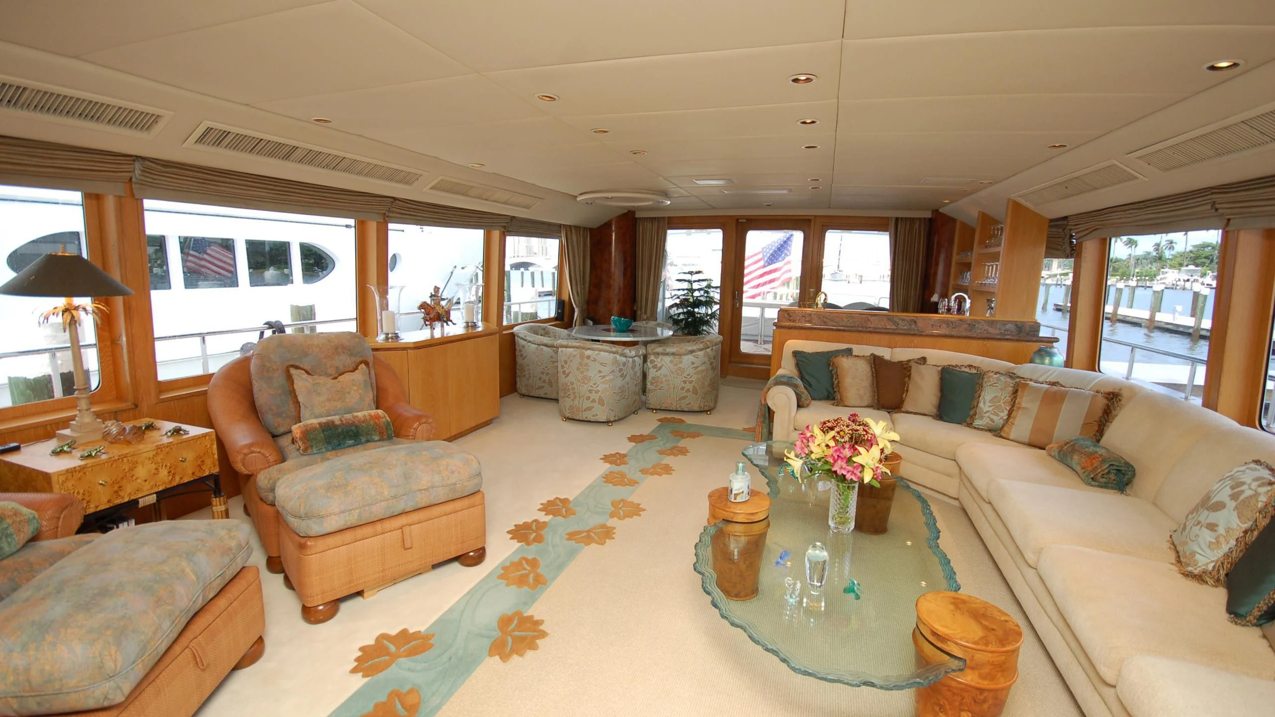 a living room with a large window aboard CONTRARIAN ROSE Yacht for Sale