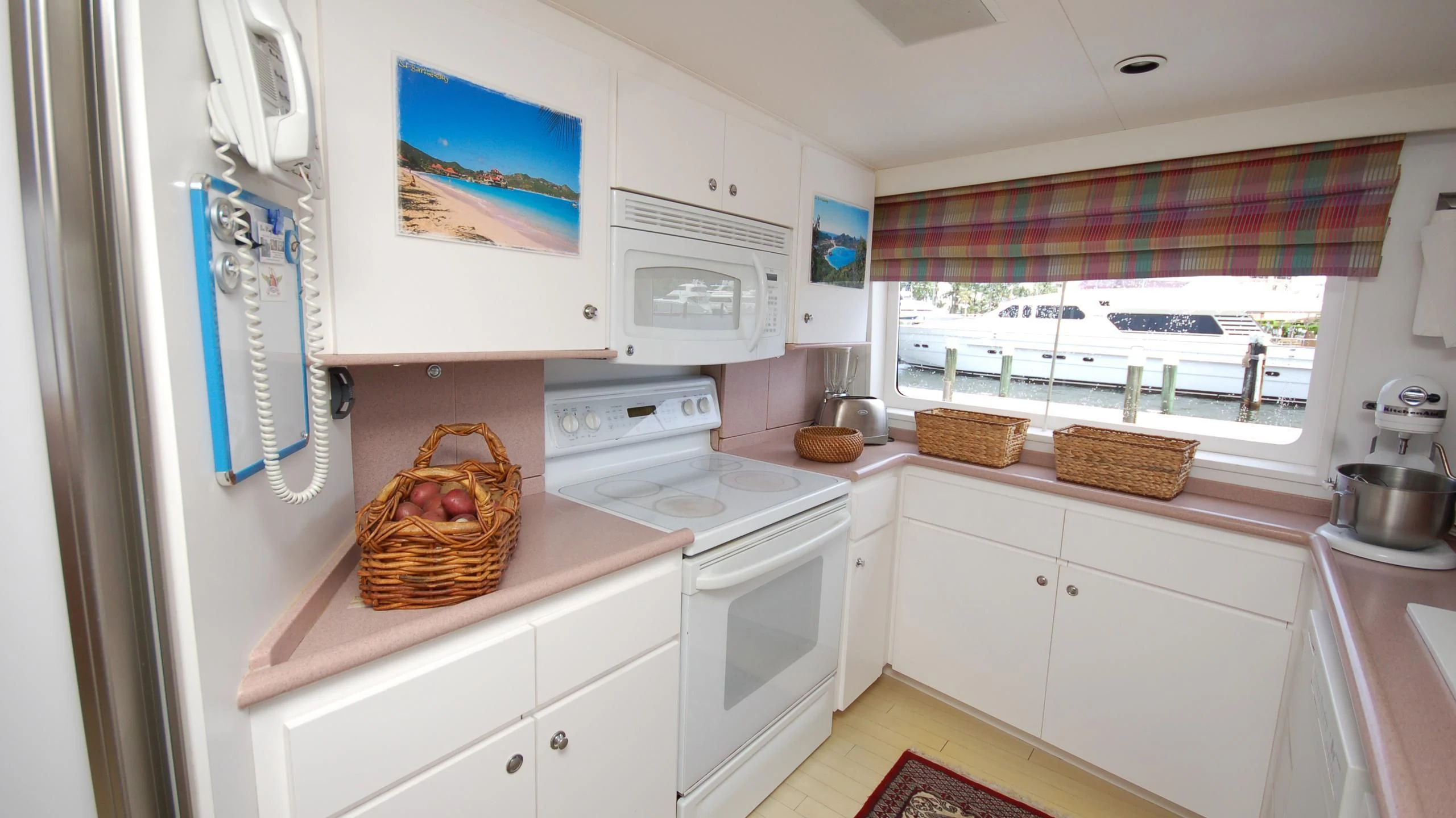 a kitchen with a basket on the counter aboard CONTRARIAN ROSE Yacht for Sale