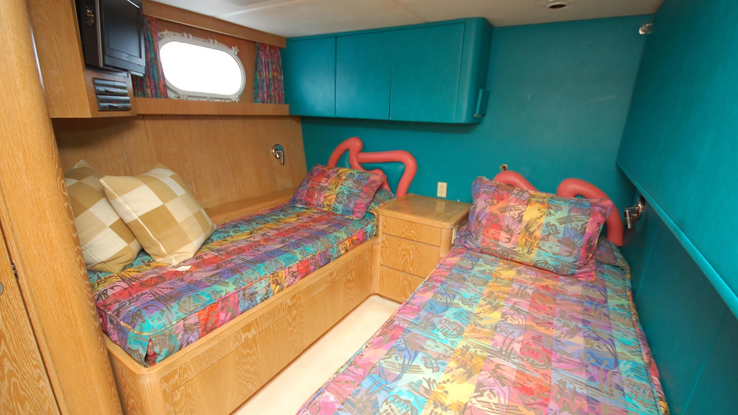 a room with a bed and a dresser aboard CONTRARIAN ROSE Yacht for Sale