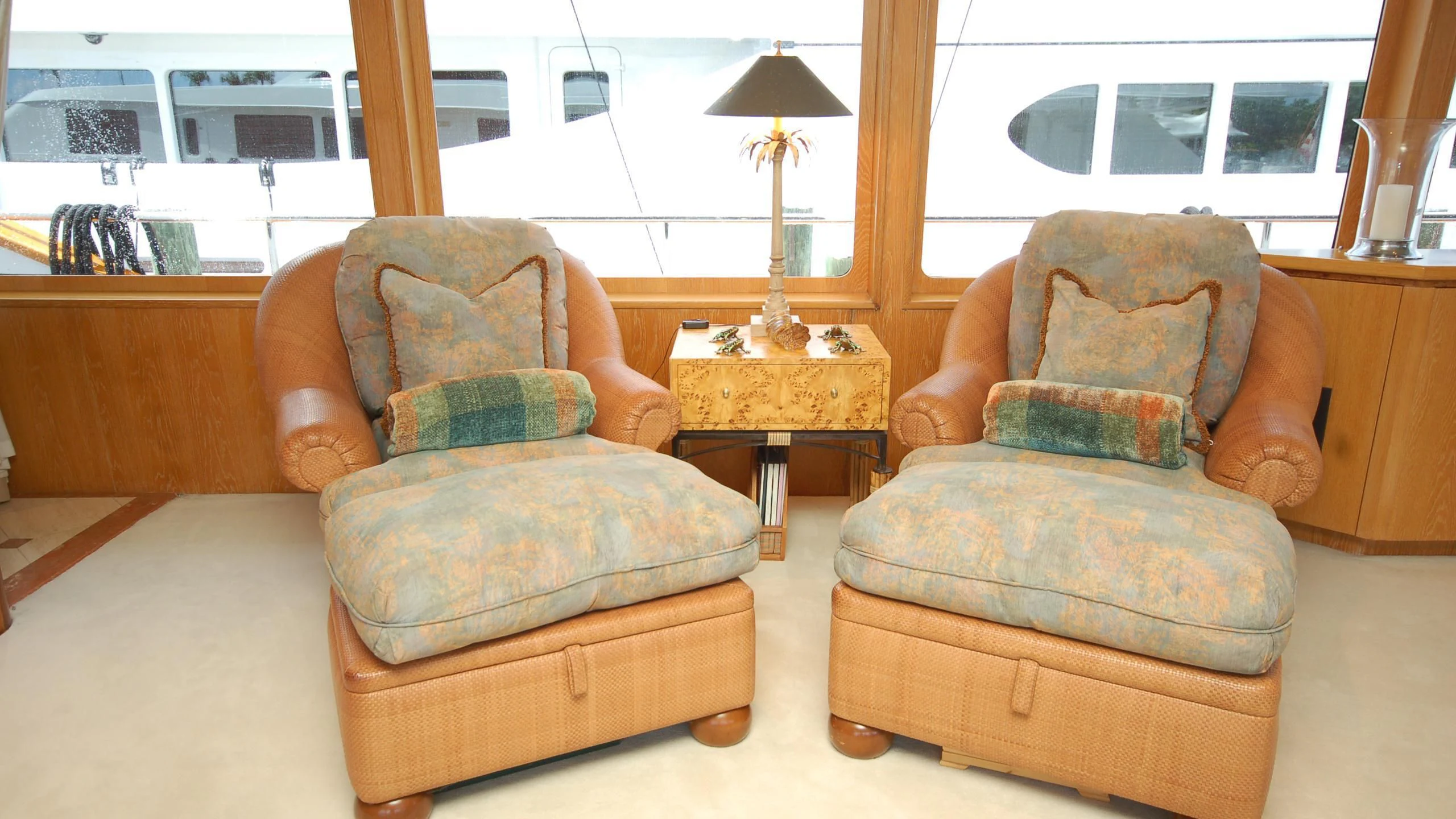 a couple of leather couches in a room aboard CONTRARIAN ROSE Yacht for Sale