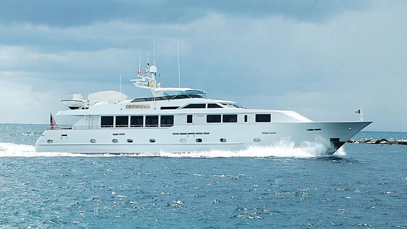 a white boat on the water aboard CONTRARIAN ROSE Yacht for Sale
