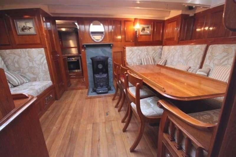 a room with a pool table and chairs aboard HALCYON Yacht for Sale