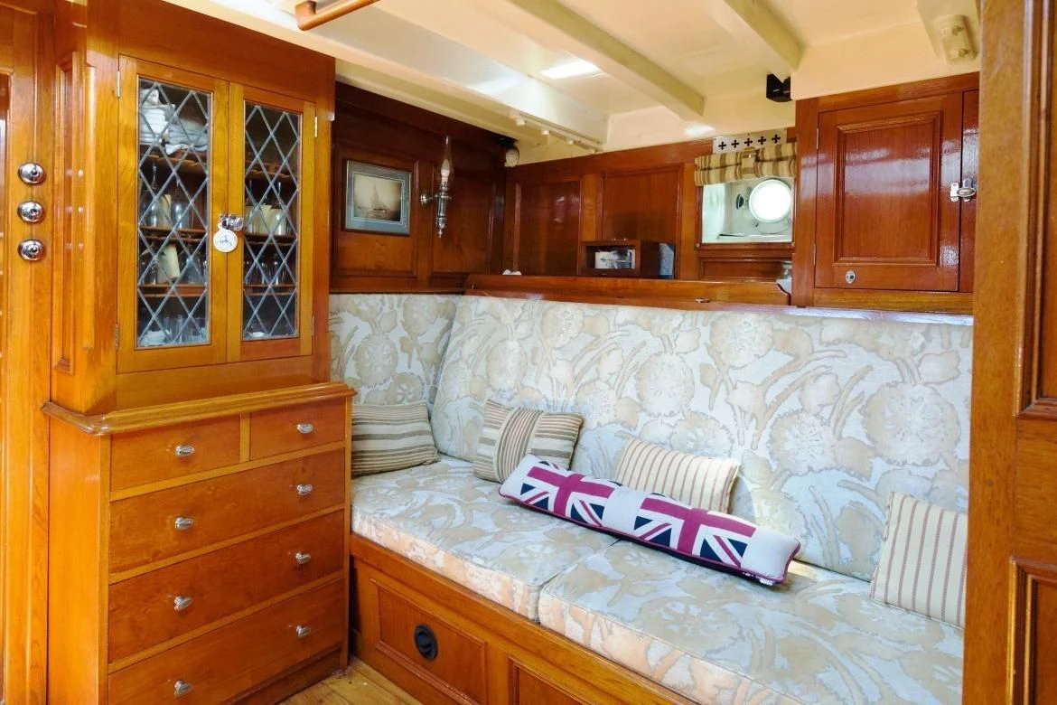 a room with wooden cabinets aboard HALCYON Yacht for Sale