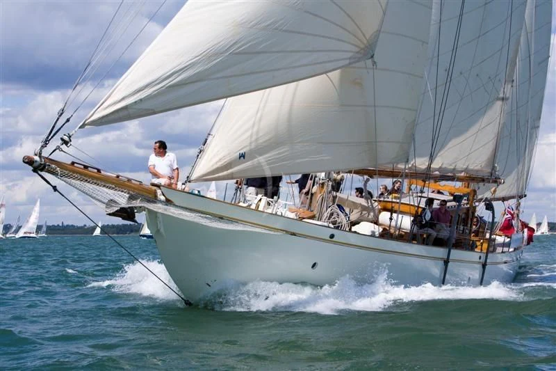 a sailboat with people on it aboard HALCYON Yacht for Sale