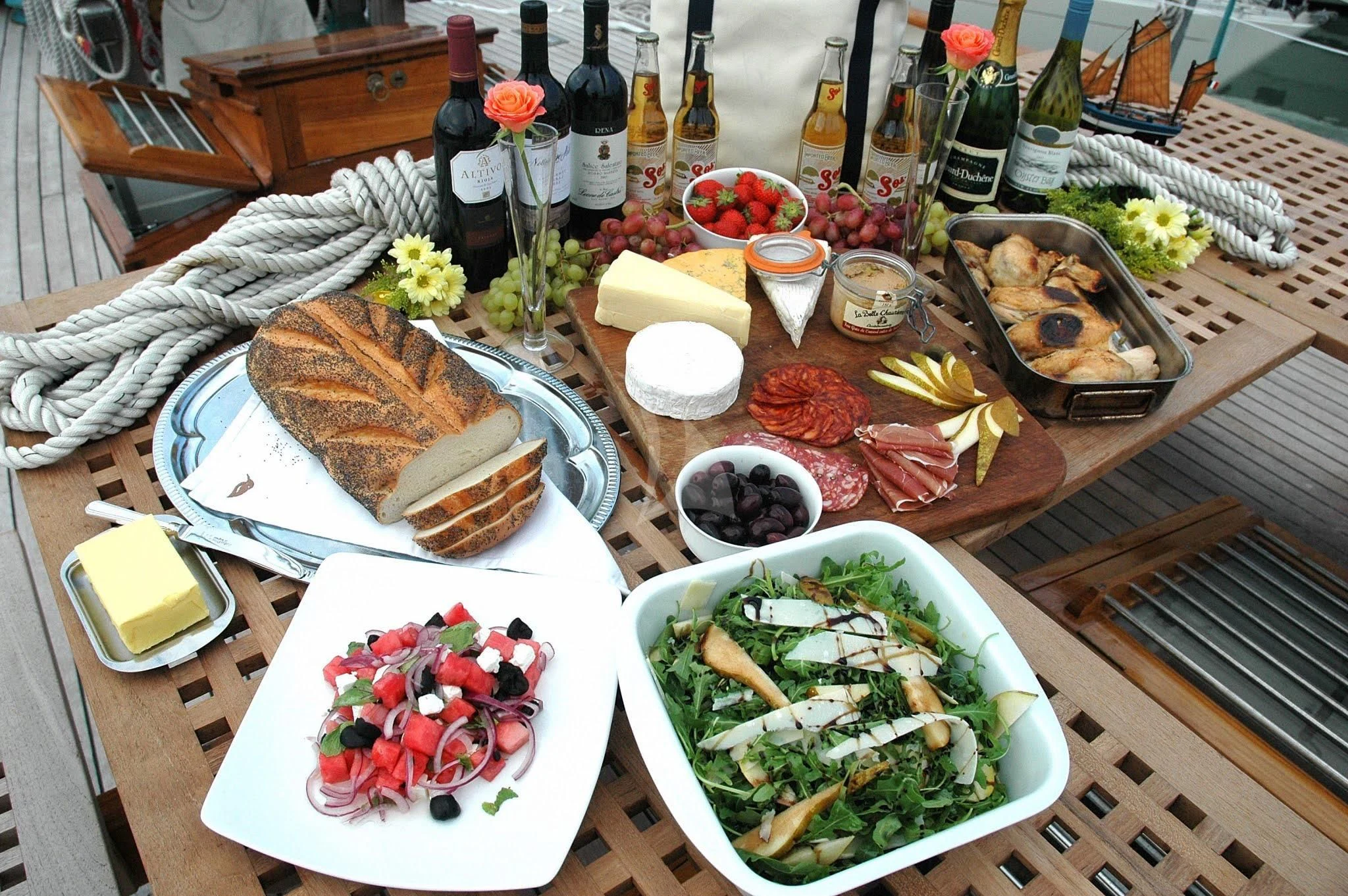 a table with food and drinks aboard HALCYON Yacht for Sale