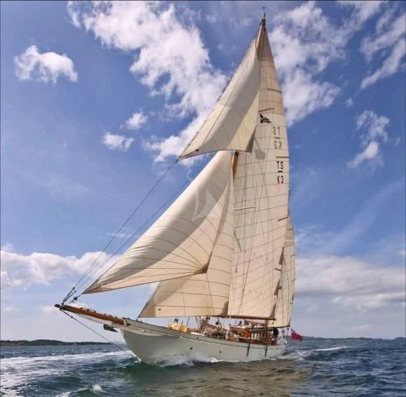 a sailboat in the ocean aboard HALCYON Yacht for Sale