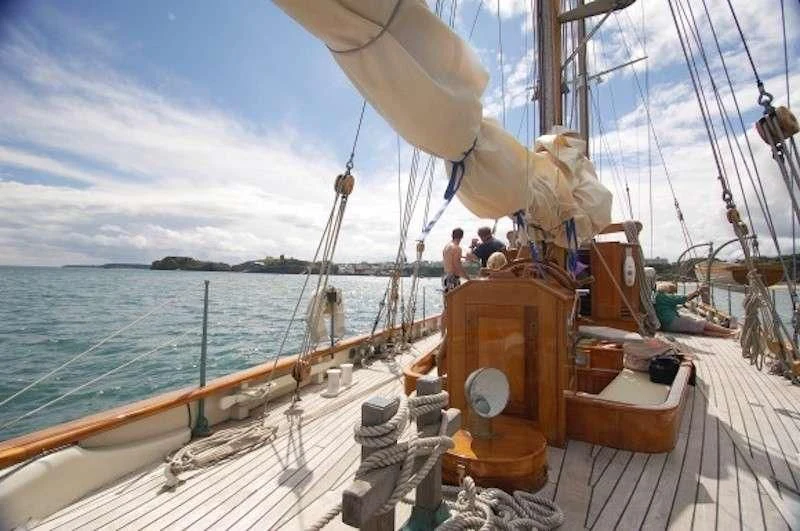 a boat with a group of people on it aboard HALCYON Yacht for Sale