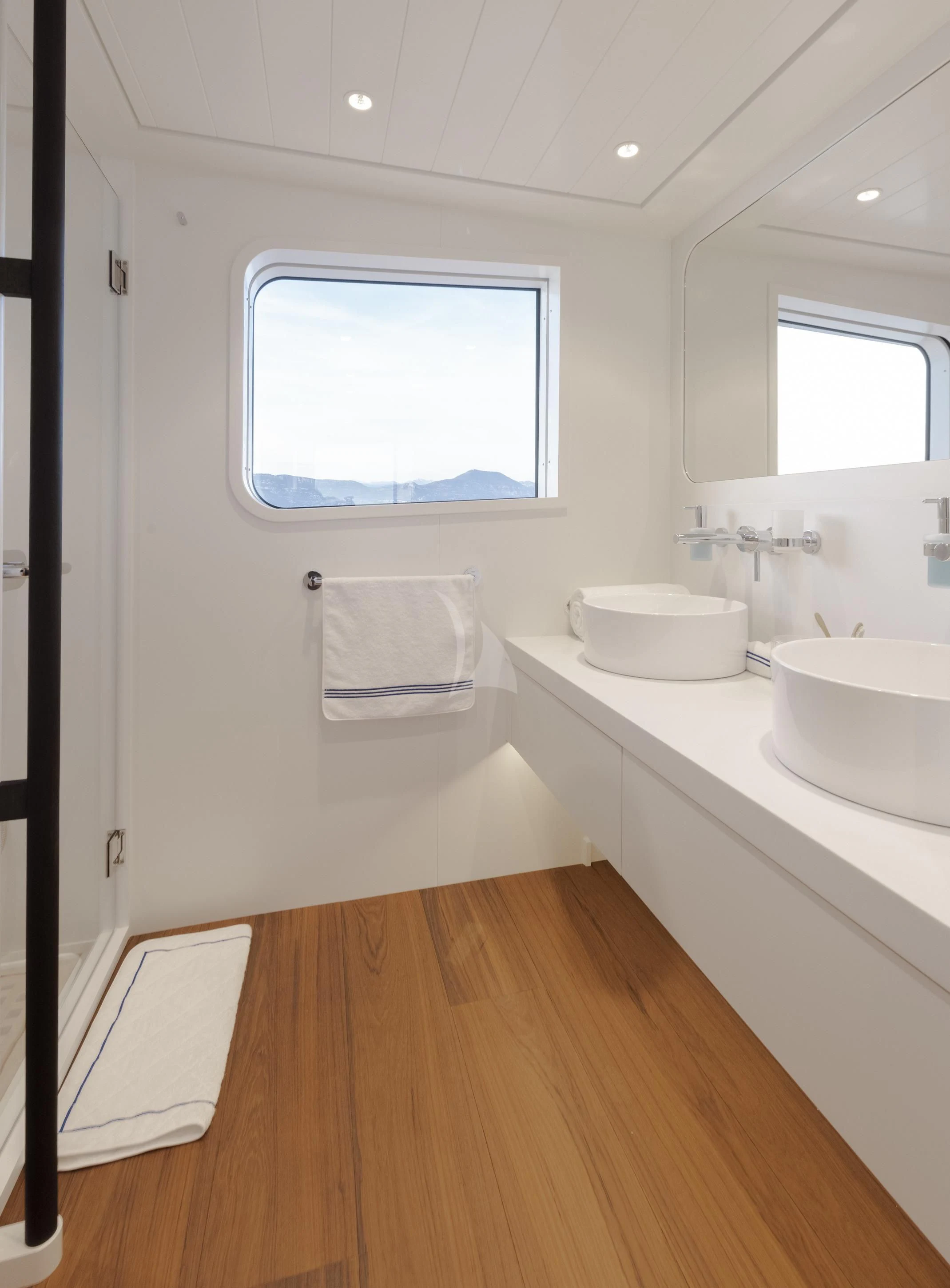 a bathroom with a sink and a window aboard ISTROS Yacht for Sale