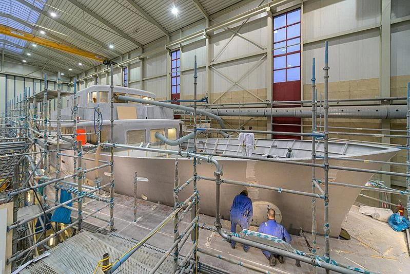 a group of people in a factory aboard ISTROS Yacht for Sale