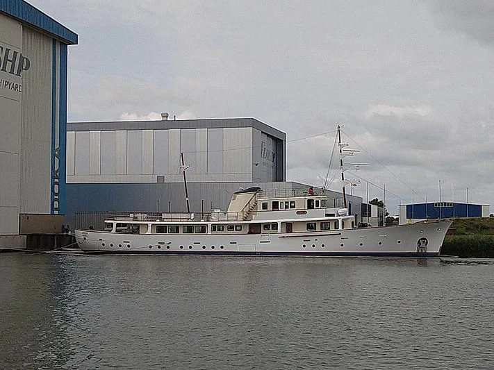 a large white boat in a harbor aboard ISTROS Yacht for Sale