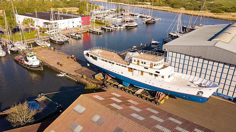 a large ship docked at a pier aboard ISTROS Yacht for Sale