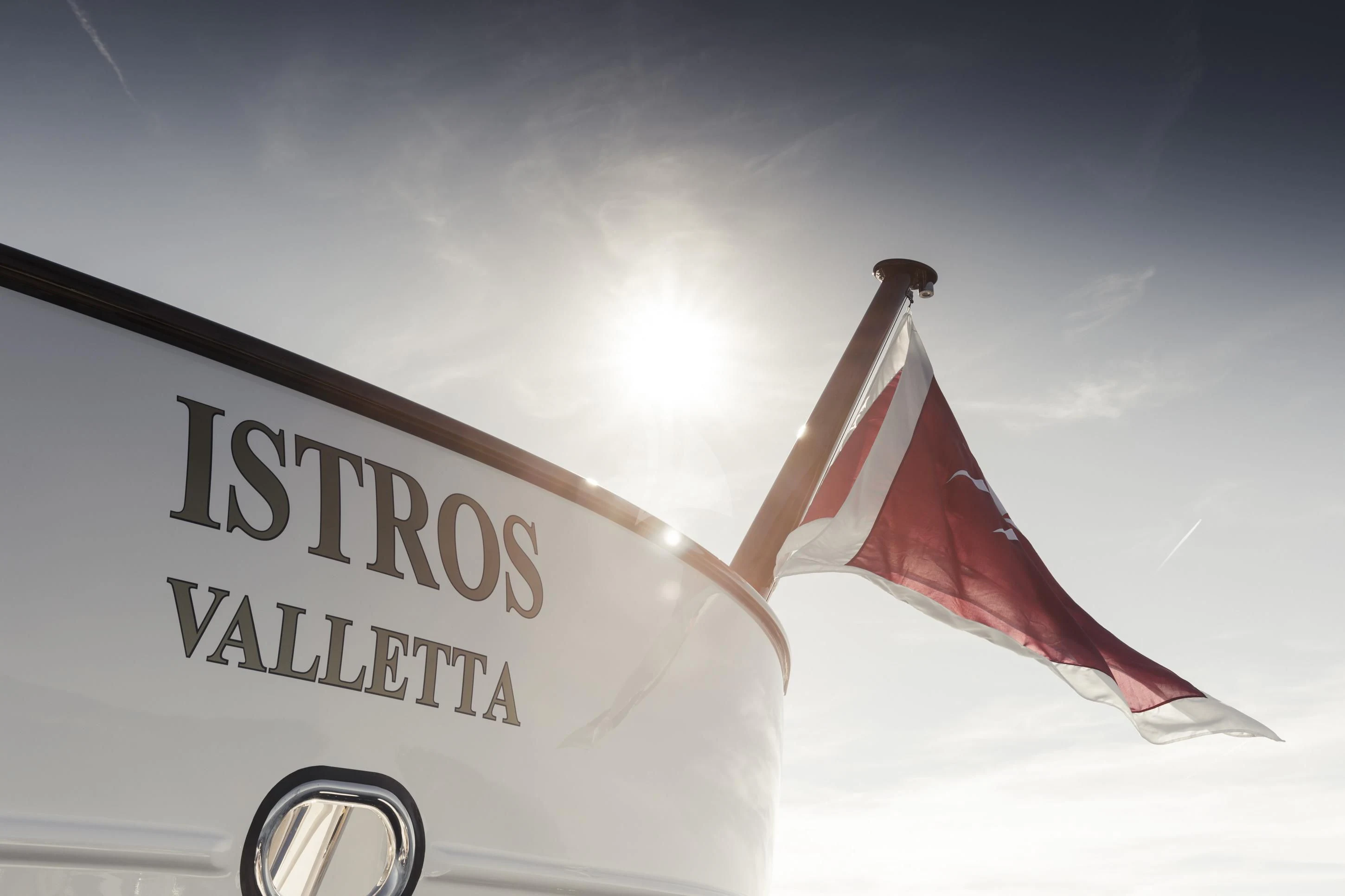 a flag flying in the sky aboard ISTROS Yacht for Sale