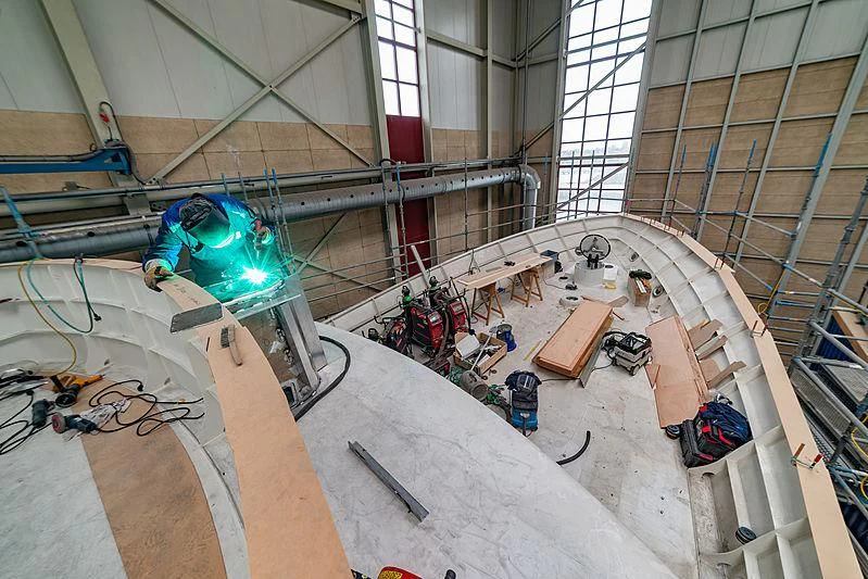 a large room with a large blue robot and a few other objects aboard ISTROS Yacht for Sale