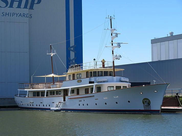 a large white boat in a harbor aboard ISTROS Yacht for Sale