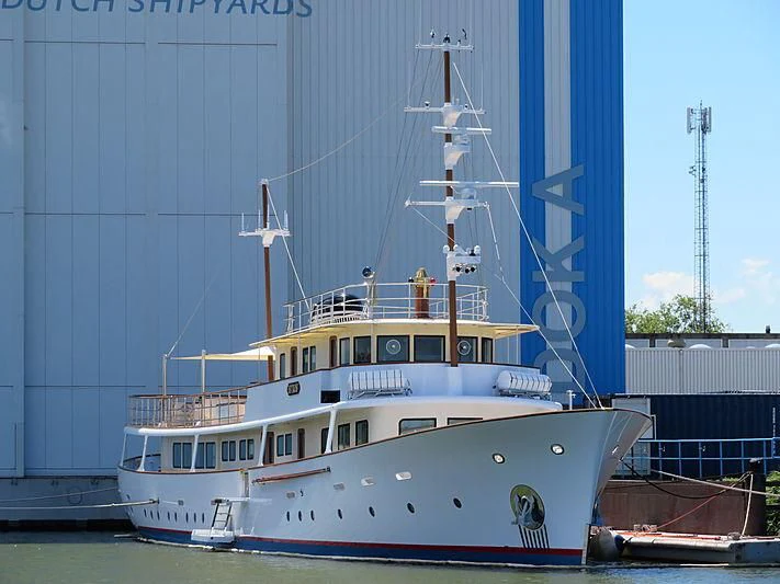 a boat docked in front of a building aboard ISTROS Yacht for Sale