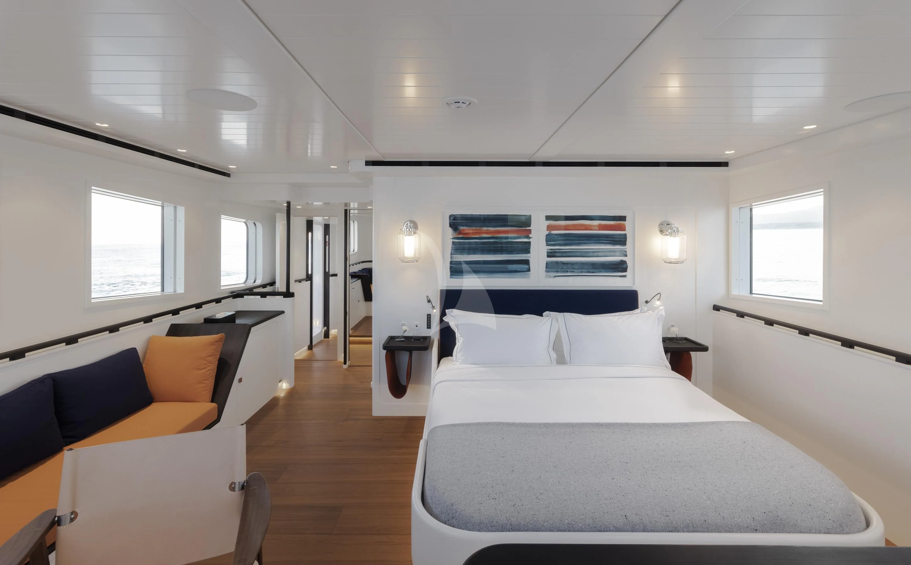 a bedroom with a bed and a couch aboard ISTROS Yacht for Sale