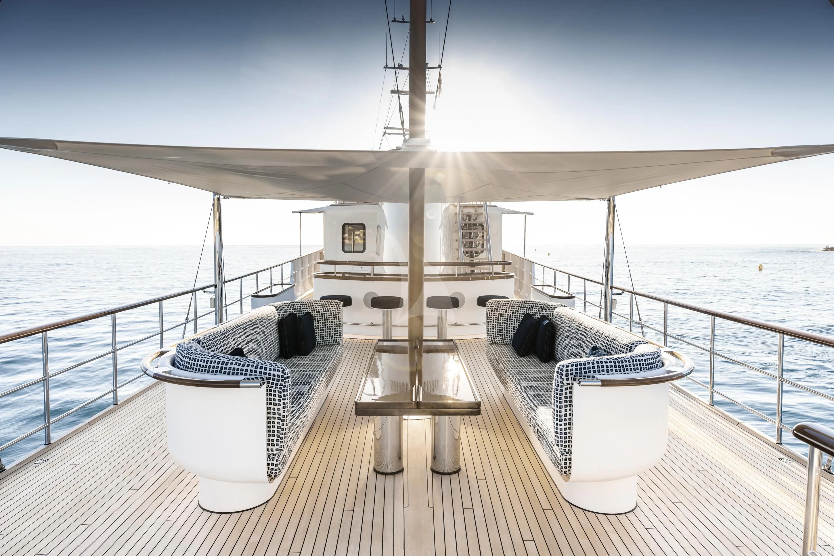 a boat dock with a bench and a table on it aboard ISTROS Yacht for Sale
