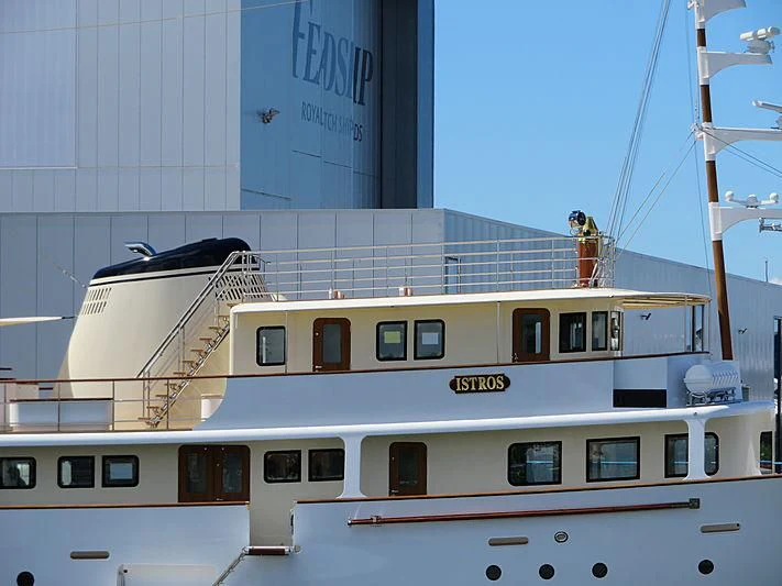 a white boat in a building aboard ISTROS Yacht for Sale