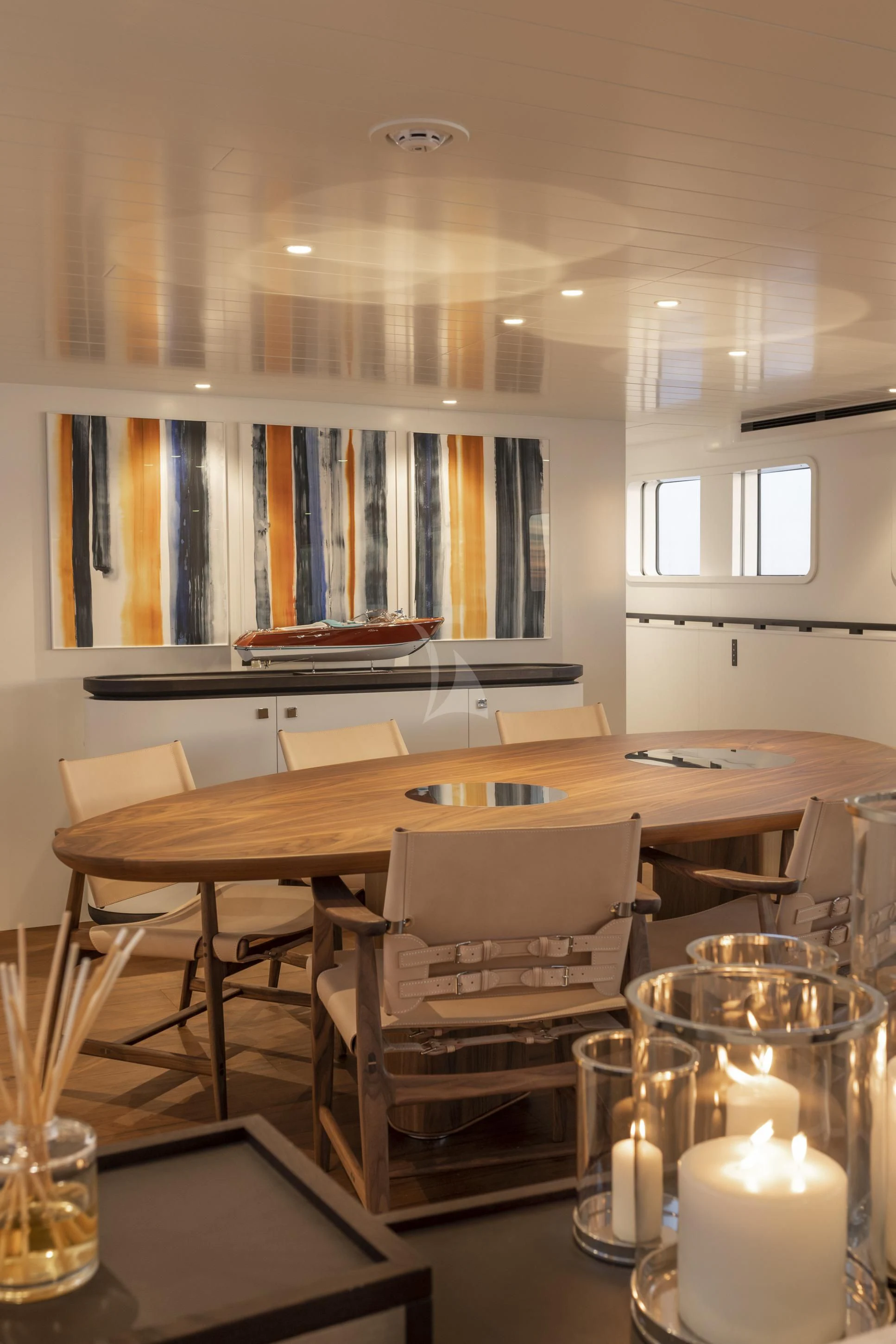 a table with chairs and a lamp aboard ISTROS Yacht for Sale