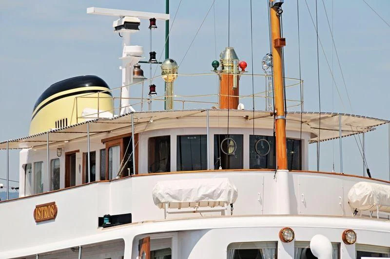 a boat with a satellite dish on the deck aboard ISTROS Yacht for Sale
