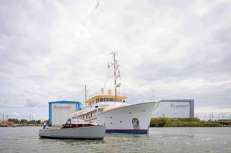a couple of boats sit in a harbor aboard ISTROS Yacht for Sale