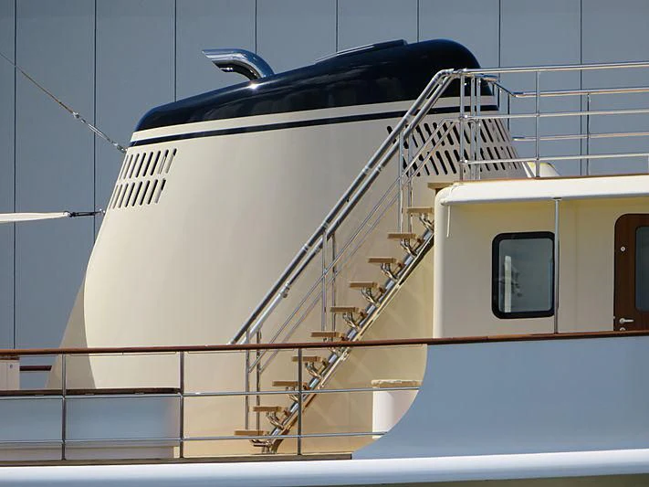 a white boat with a black canopy aboard ISTROS Yacht for Sale