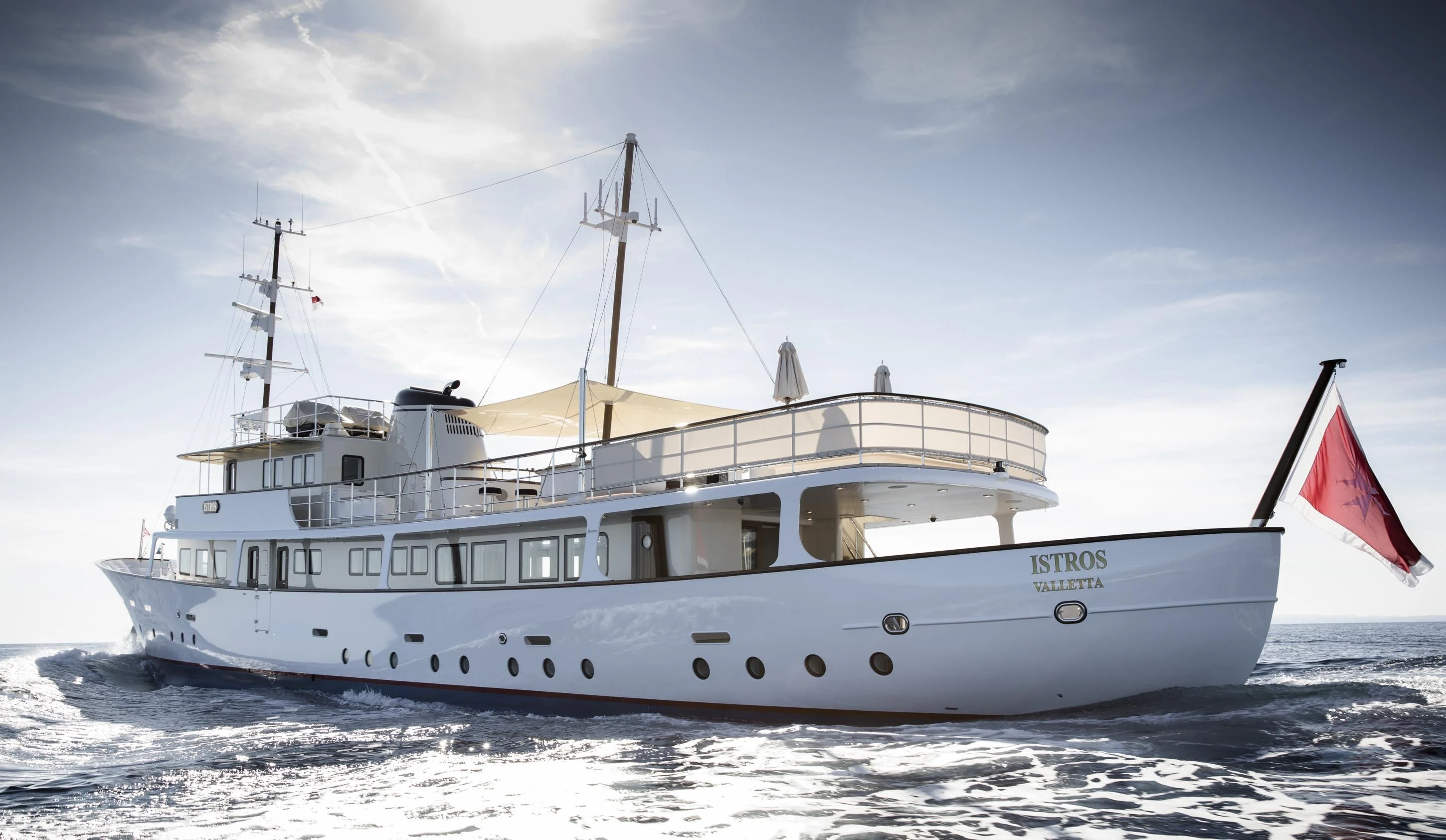 a large white boat in the water aboard ISTROS Yacht for Sale